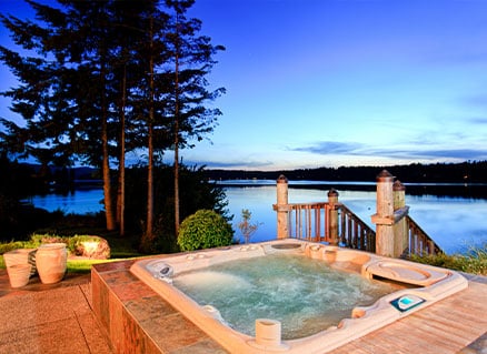 hot tub by a lake